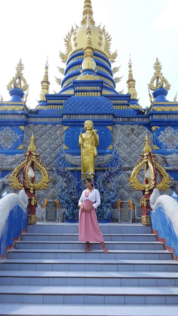 solo female traveler in blue temple in chiang mai thailand