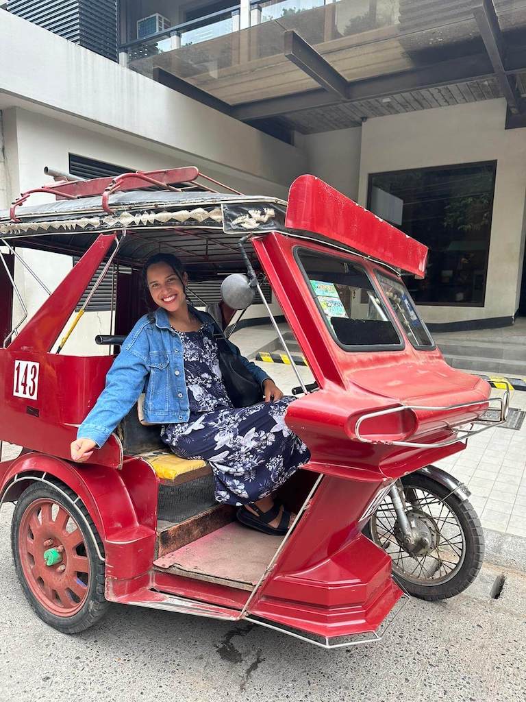 Solo female traveler in a jeepney while visiting Coron, Palawan, Philippines