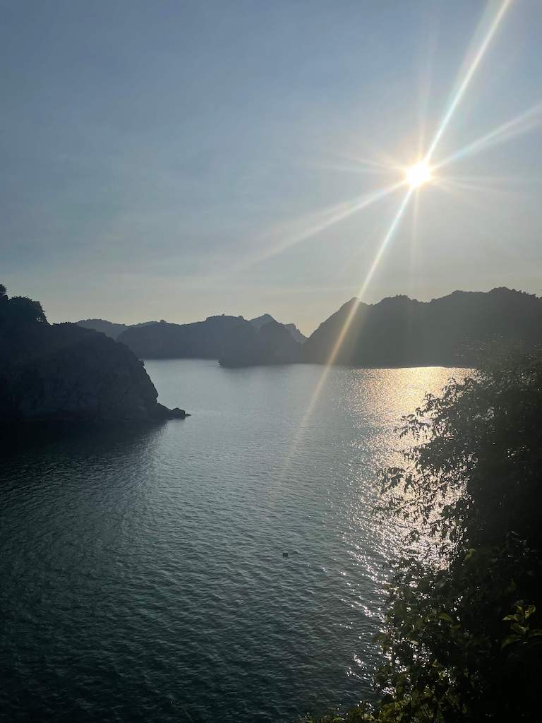 Cat Ba cliffs and waters with a bright full sun